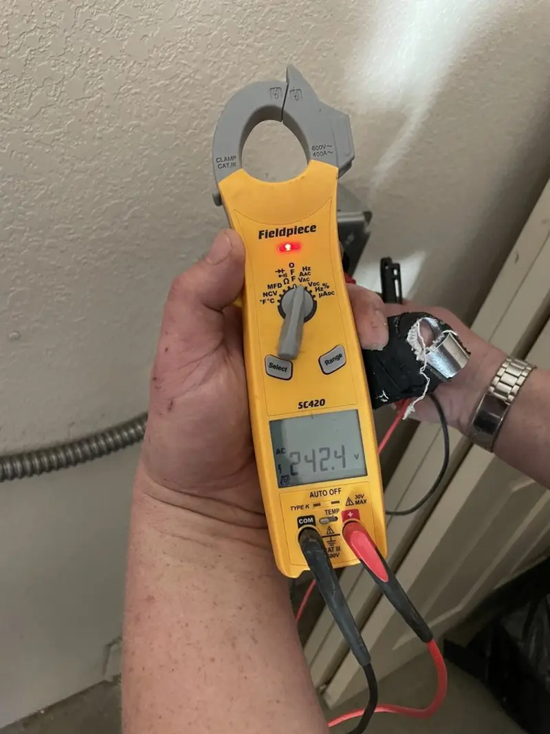 Voltage testing with clamp meter during Outlet Installation in Woodland Park
